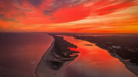 Atardecer en la flecha del Portil. Fuente: X de Rafafelsanexp